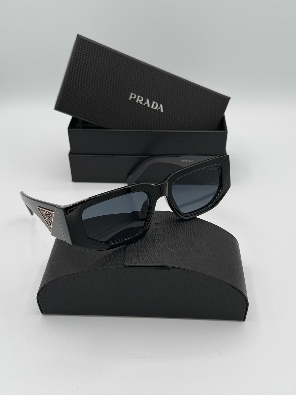 Prada Glossy Black Rectangle Sunglasses Gold Accents Designer Eyewear Unisex